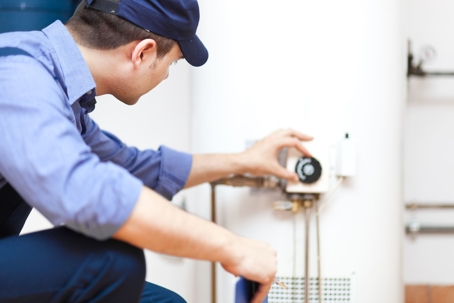 Technician checks water heater