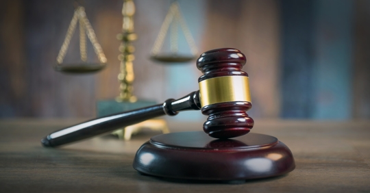 Mallet of the judge, books, scales of justice.